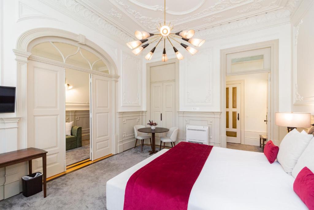 Ένα ή περισσότερα κρεβάτια σε δωμάτιο στο Marquês Garden House by Olivia