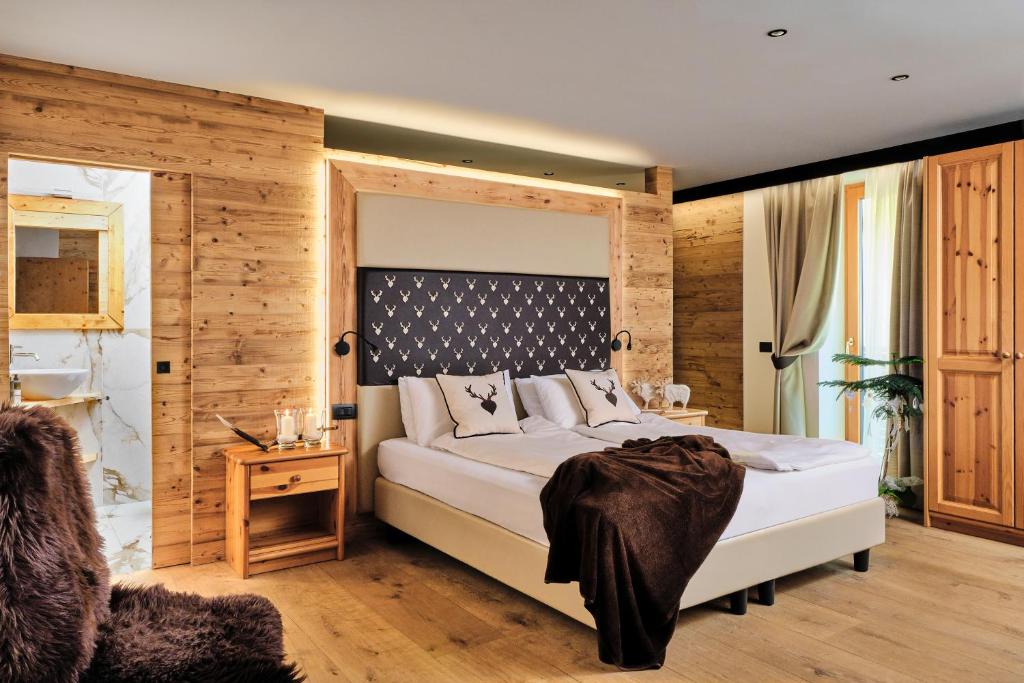 Postel nebo postele na pokoji v ubytování Boutique Hotel e Chalets Salvadori