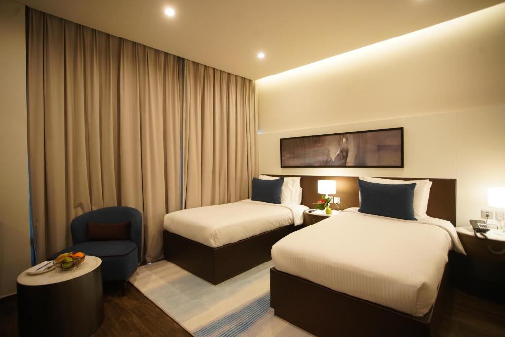 Postel nebo postele na pokoji v ubytování C - Hotel and Suites Doha