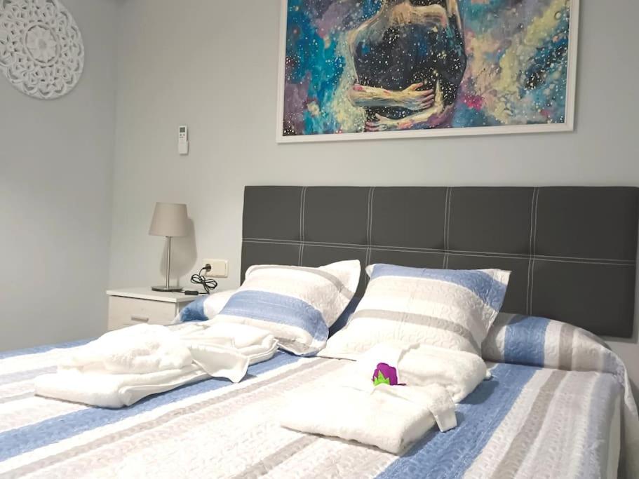 A bed or beds in a room at Acogedora y confortable casa familiar en L'Olleria