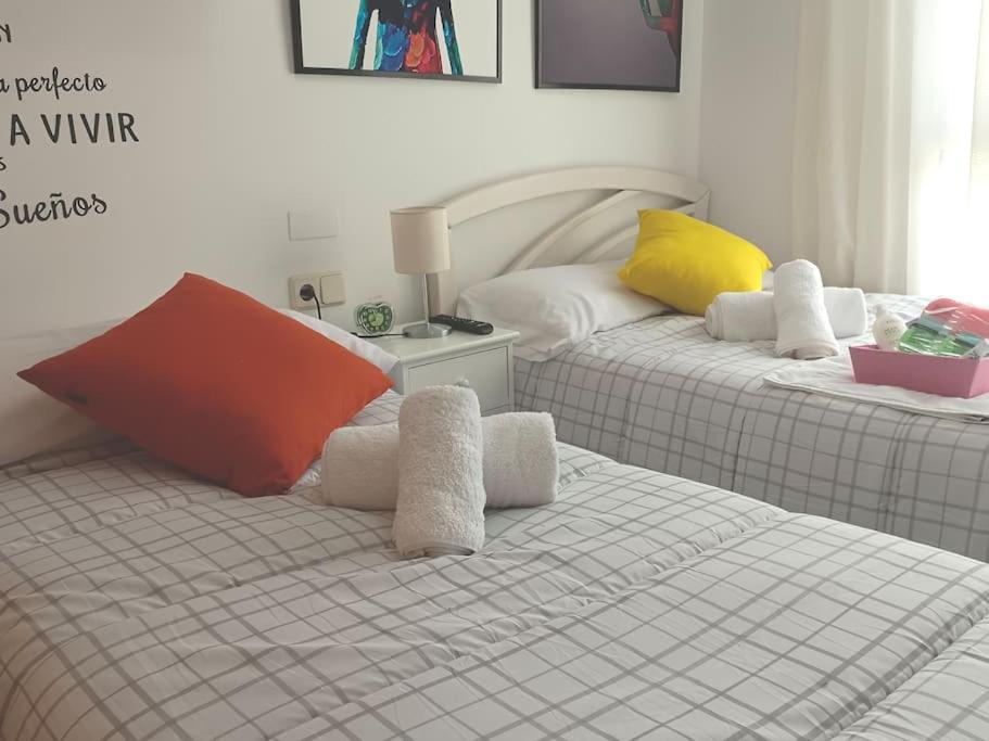 A bed or beds in a room at Acogedora y confortable casa familiar en L'Olleria