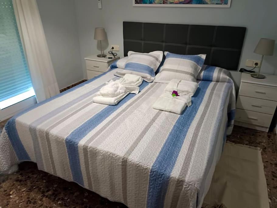 A bed or beds in a room at Acogedora y confortable casa familiar en L'Olleria