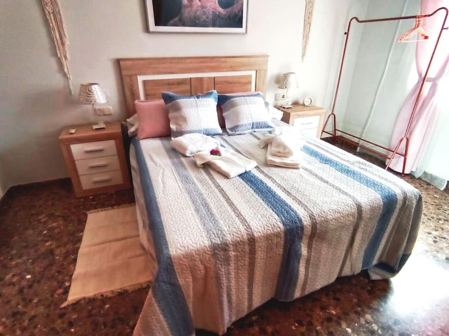 A bed or beds in a room at Acogedora y confortable casa familiar en L'Olleria