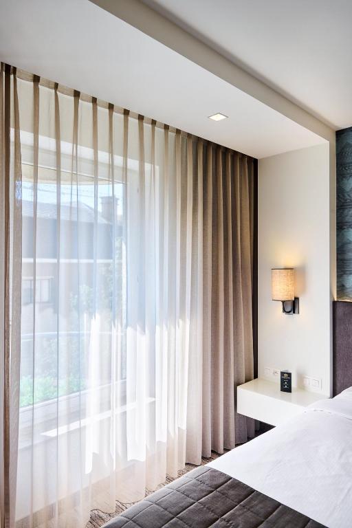 Postel nebo postele na pokoji v ubytování Keizershof Hotel Aalst