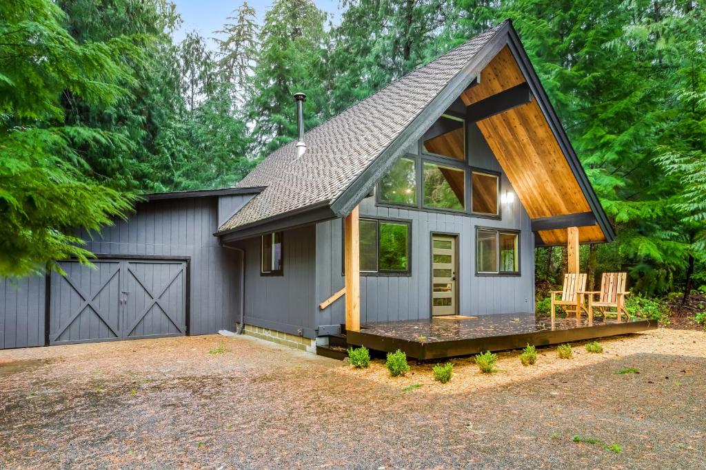 a house with a gambrel roof and a garage at Alderbrook A-Frame in Union