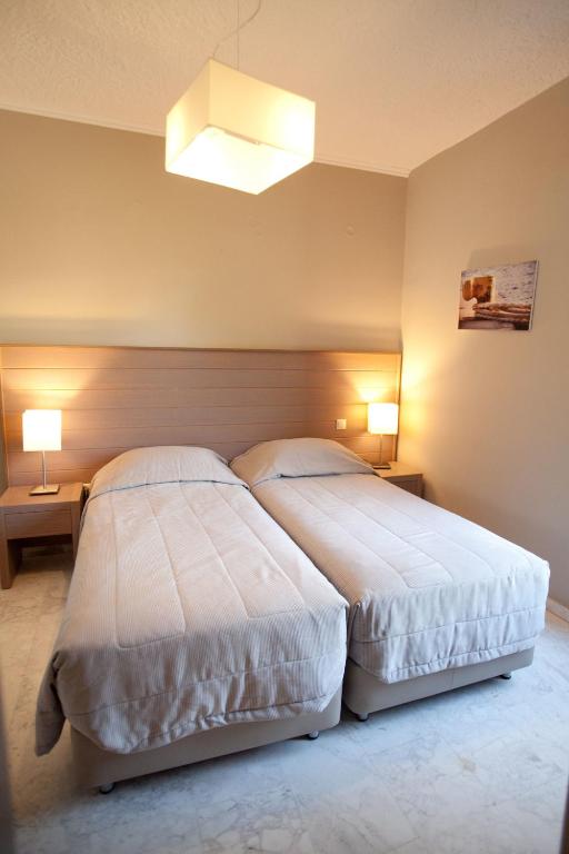 Postel nebo postele na pokoji v ubytování Kalydna Island Hotel