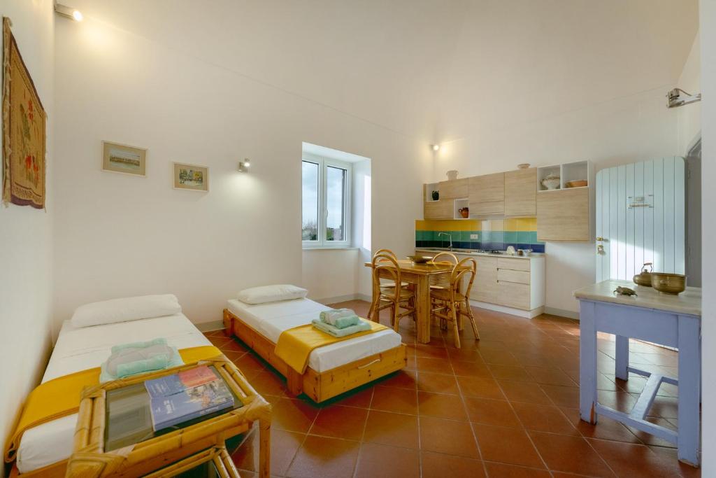 Postel nebo postele na pokoji v ubytování TORRETTA CORRICELLA- Punta Pizzaco