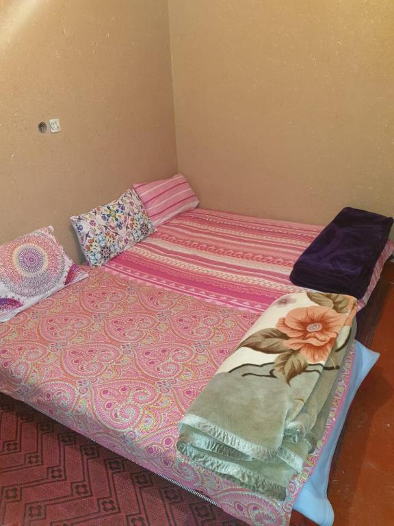 Postel nebo postele na pokoji v ubytování Guest House Imdoukal