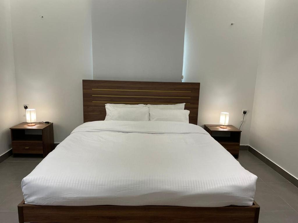 Postel nebo postele na pokoji v ubytování LADAN APARTMENT
