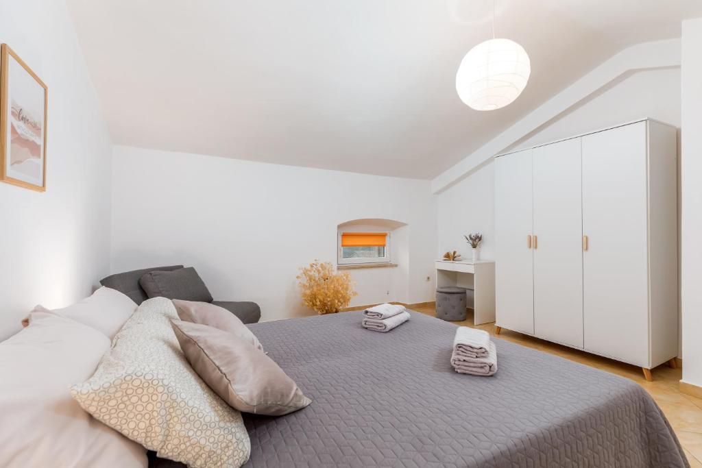 Łóżko lub łóżka w pokoju w obiekcie Apartment Dignano