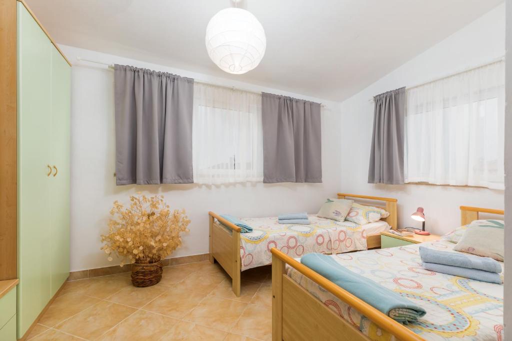 Łóżko lub łóżka w pokoju w obiekcie Apartment Dignano