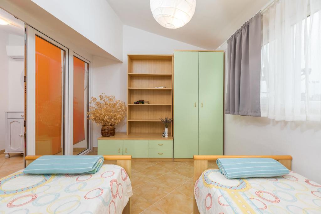Łóżko lub łóżka w pokoju w obiekcie Apartment Dignano