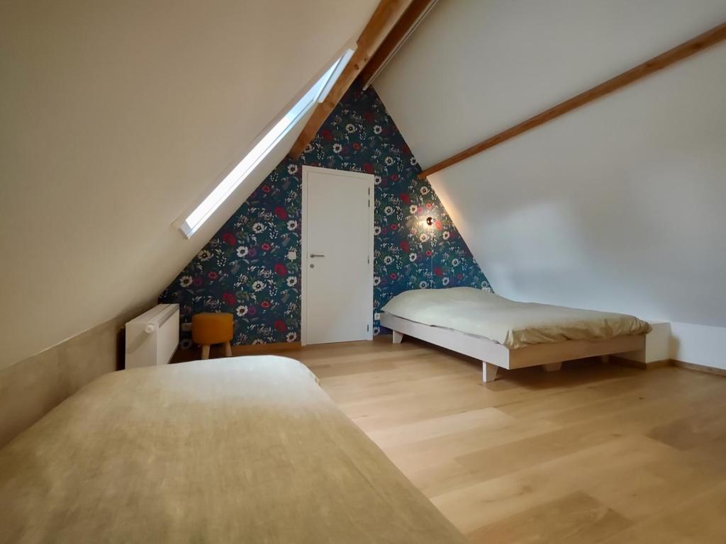 Postel nebo postele na pokoji v ubytování Nachtegael Zomerhuis, idyllische woning in de Vlaamse Ardennen