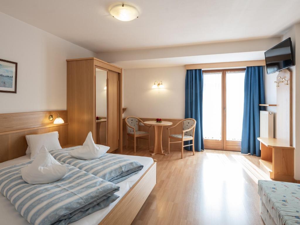 Postel nebo postele na pokoji v ubytování Hotel B&B Martha
