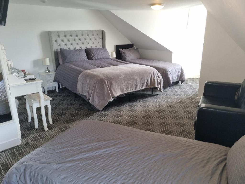 Postel nebo postele na pokoji v ubytování Windsor house