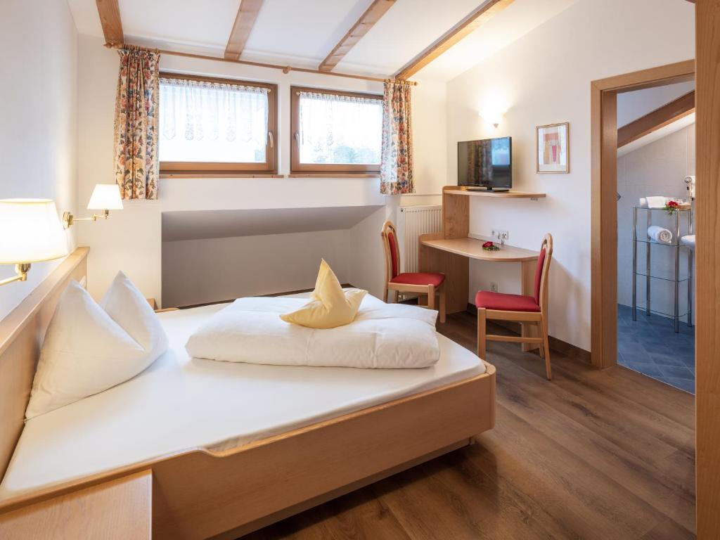 Postel nebo postele na pokoji v ubytování Hotel B&B Martha