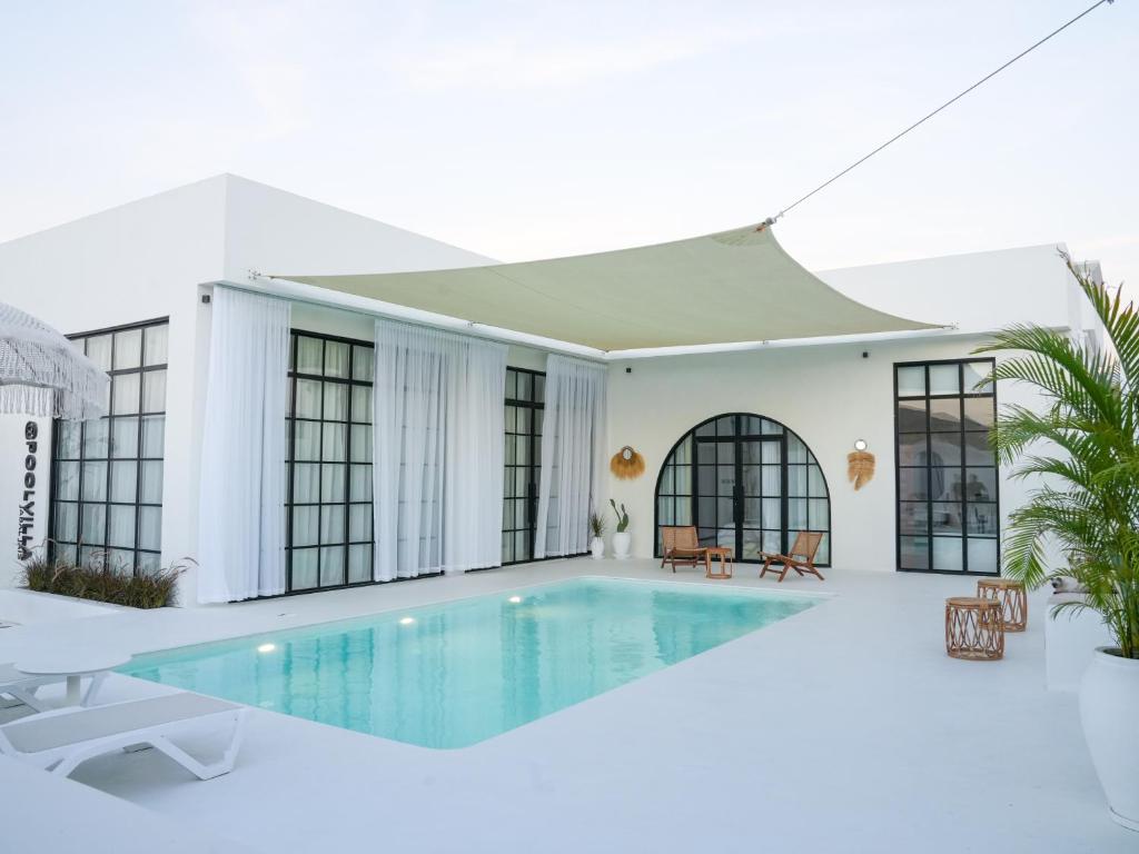 a villa with a swimming pool and a house at Pool Villa Jebel Jais in Şāliḩīyah