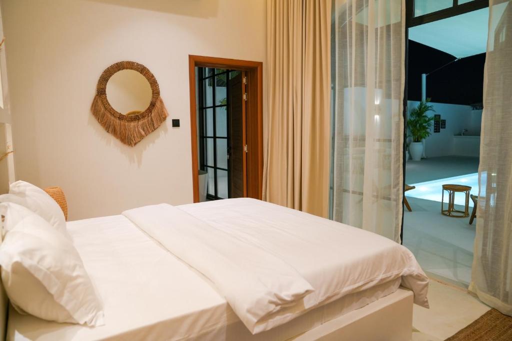 Voodi või voodid majutusasutuse Pool Villa Jebel Jais toas