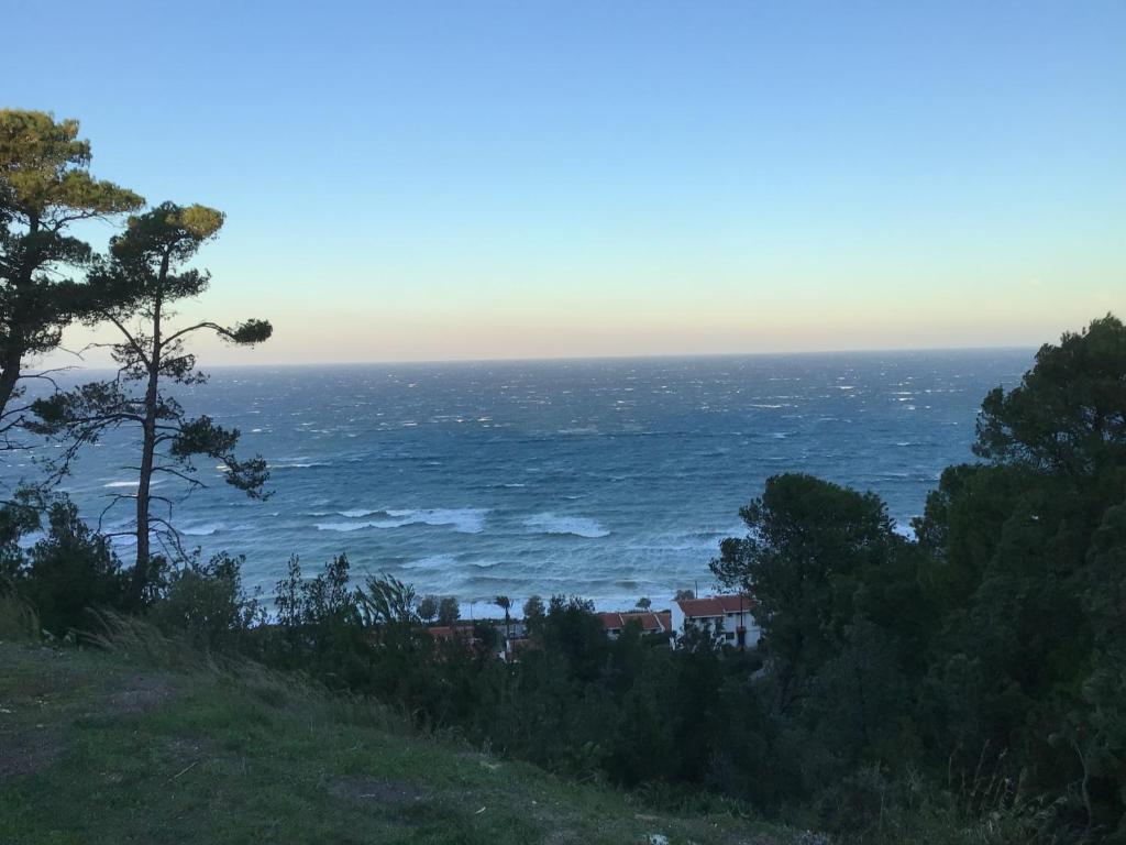 a view of the ocean from a hill at Country house with amazing sea view in Kassandria