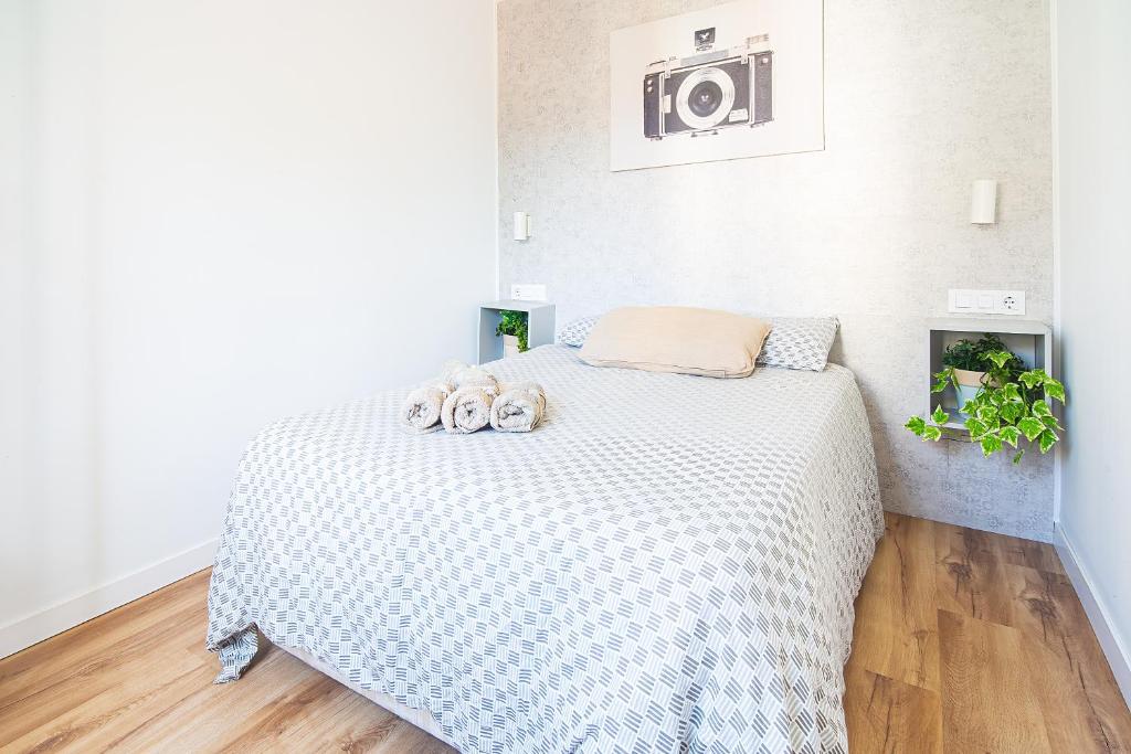 Postel nebo postele na pokoji v ubytování CARTAGENAFLATS, Apartamentos Anfiteatro Romano 5A