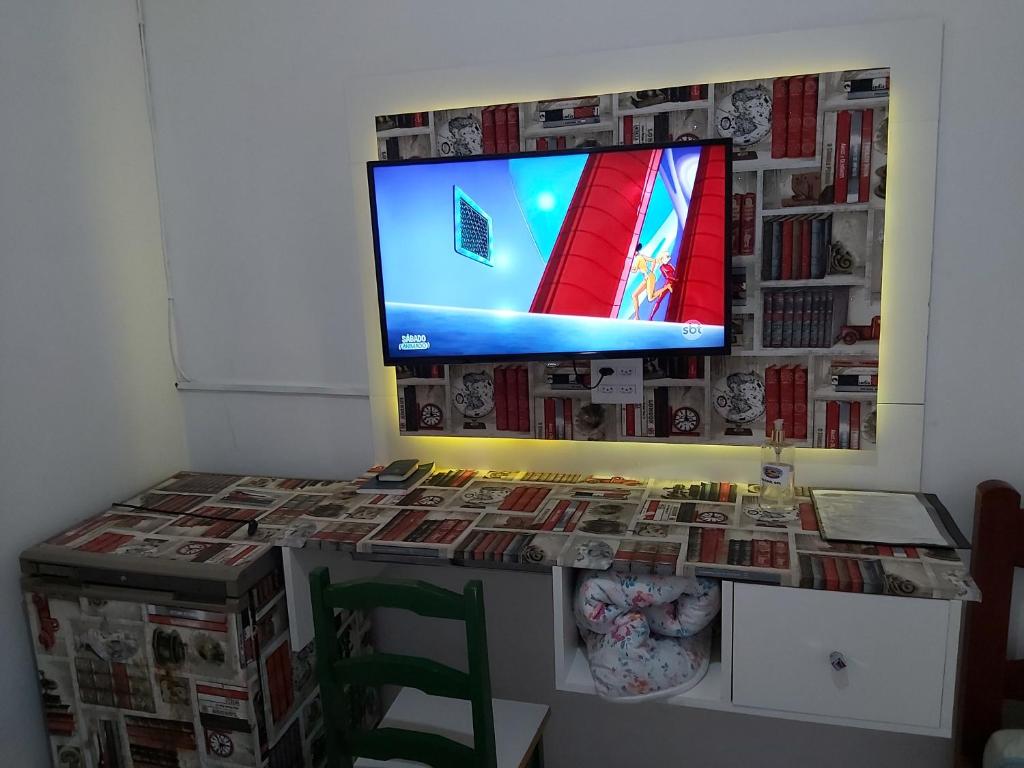 TV a/nebo společenská místnost v ubytování Hotel Pousada Girassol