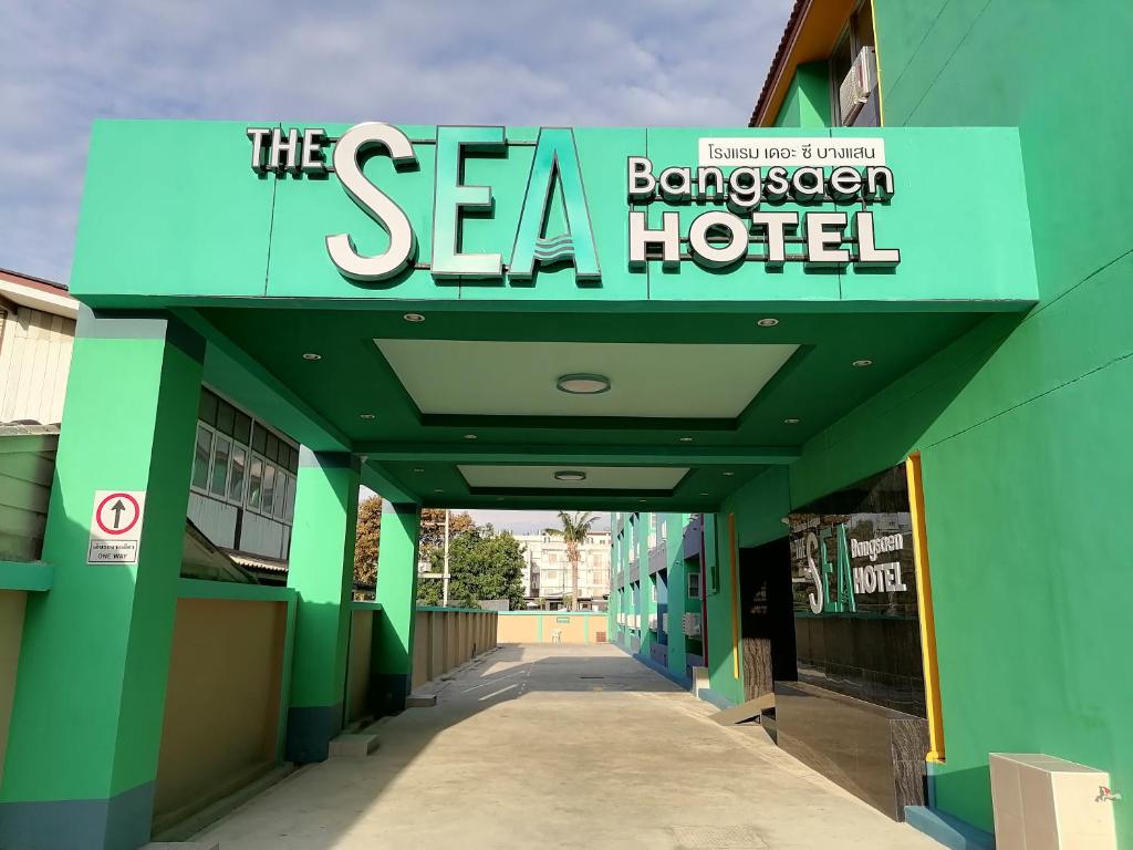 a building with a sign that reads the sea bayer hospital at The Sea Bangsaen Hotel in Ban Bang Saen (1)