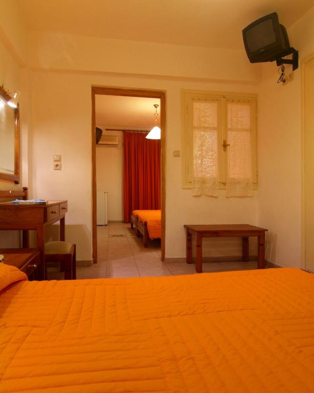 Postel nebo postele na pokoji v ubytování Hotel Orfeas