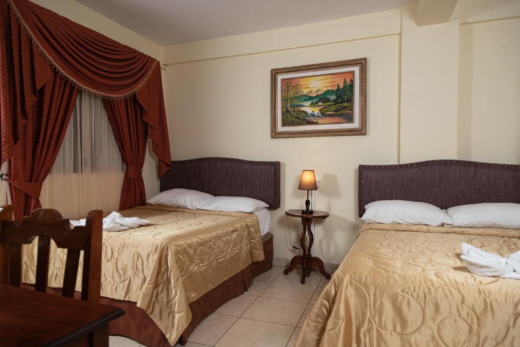 Postel nebo postele na pokoji v ubytování Hotel Internacional Palmerola