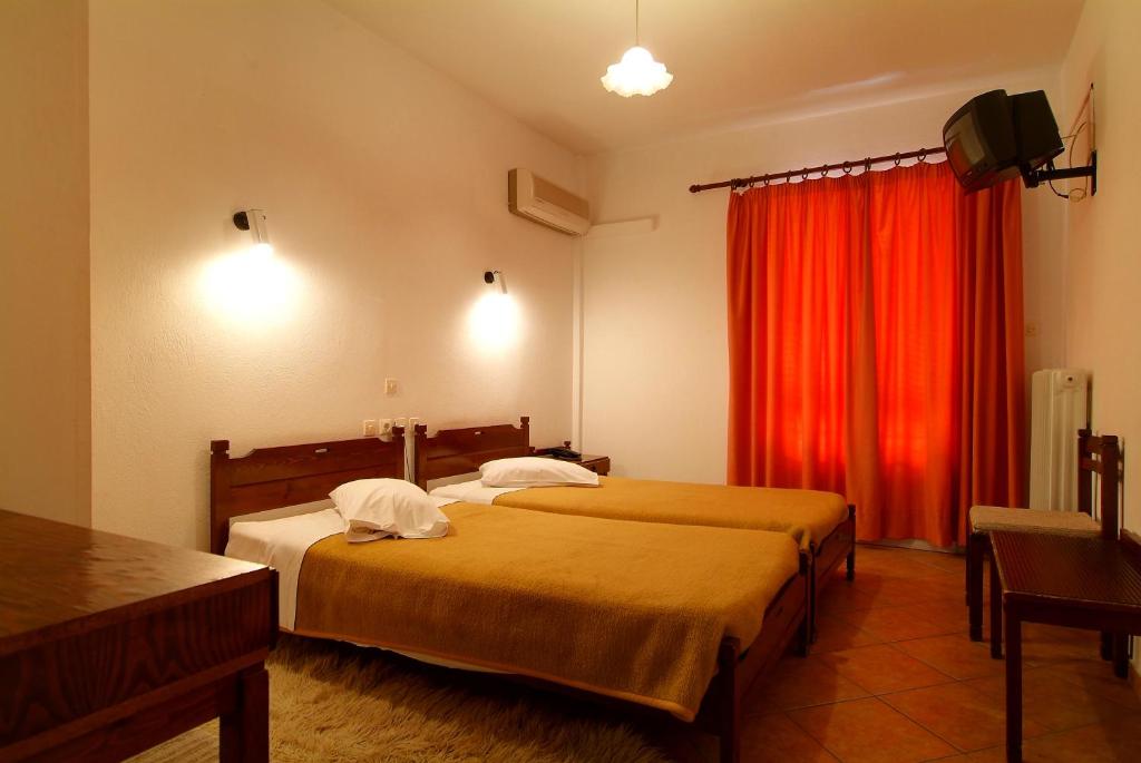 Postel nebo postele na pokoji v ubytování Hotel Orfeas
