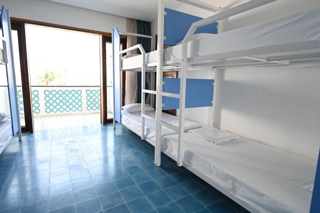 Postel nebo postele na pokoji v ubytování Fuse Beachside Hoi An