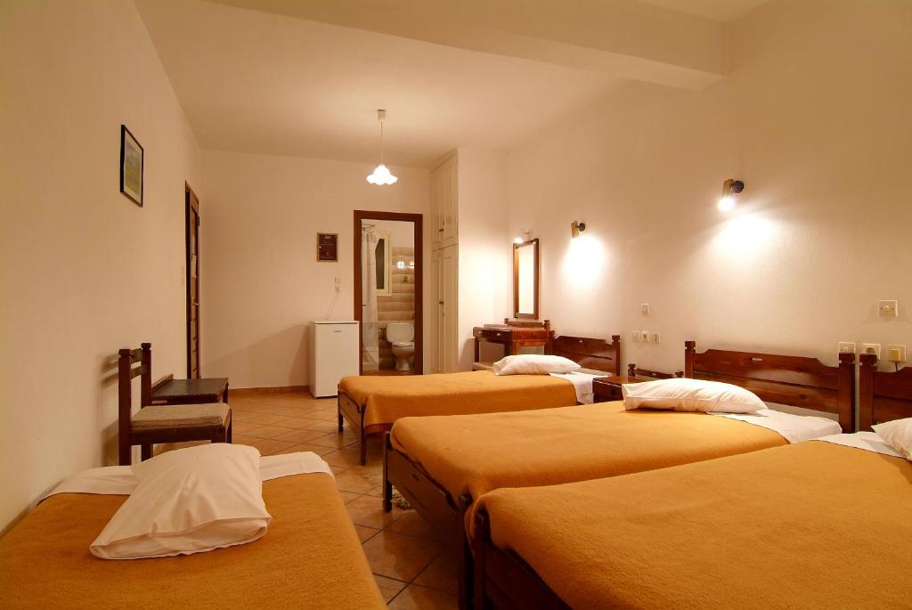 Postel nebo postele na pokoji v ubytování Hotel Orfeas
