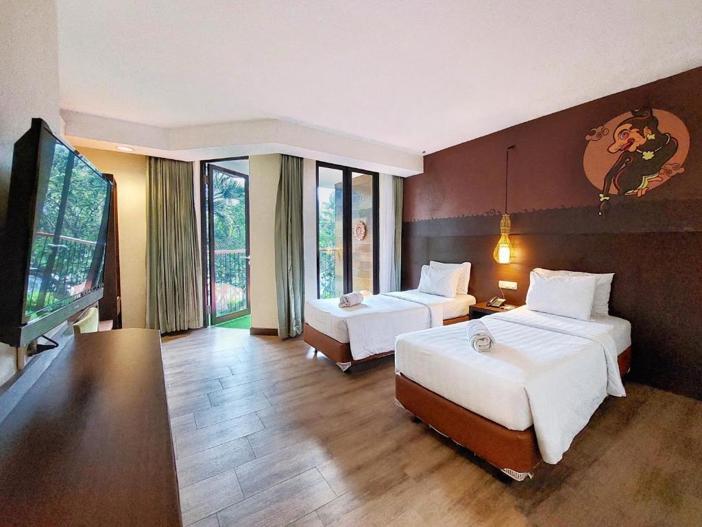 Postel nebo postele na pokoji v ubytování The Batu Hotel & Villas