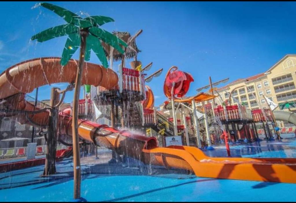 a water park with a water slide in a pool at 5 minutes away from Disney, Westgate Resort in Orlando