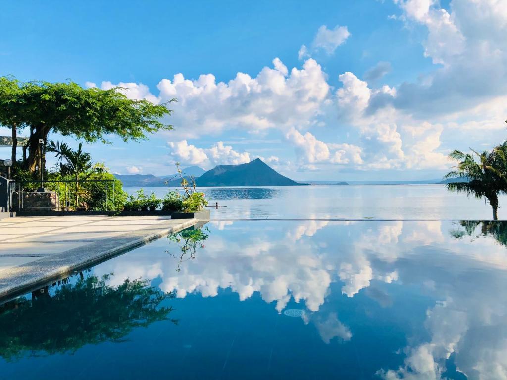 a swimming pool with a view of the water at Nuuk Taal Lake in Laurel