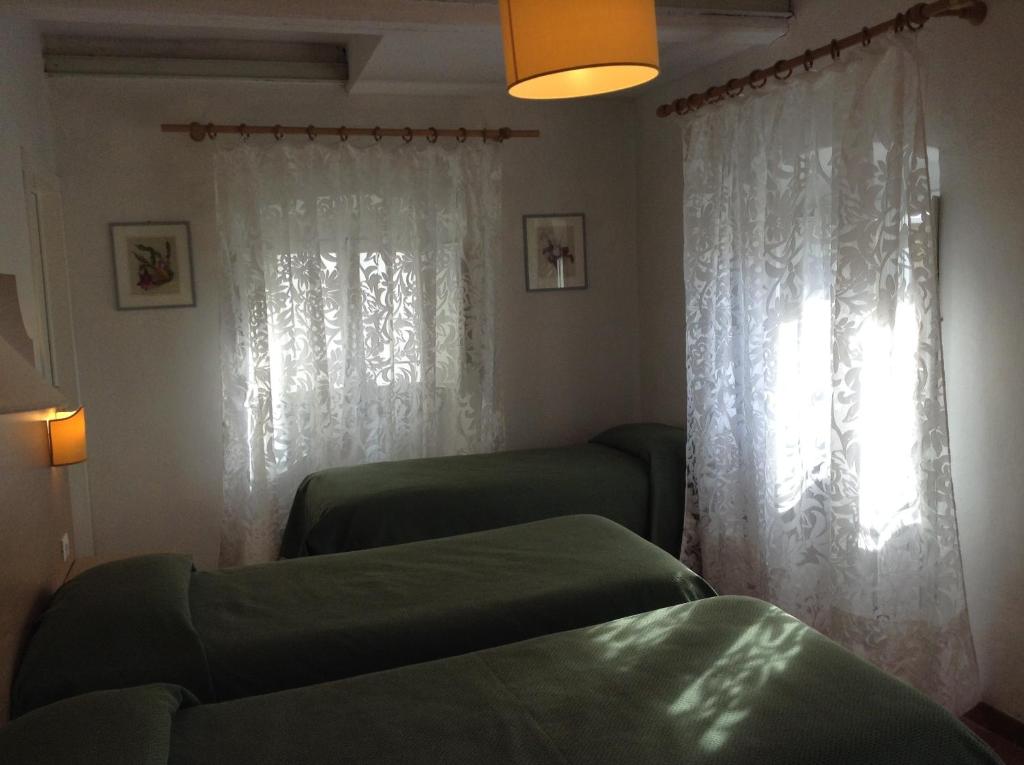 Postel nebo postele na pokoji v ubytování Albergo Giugni