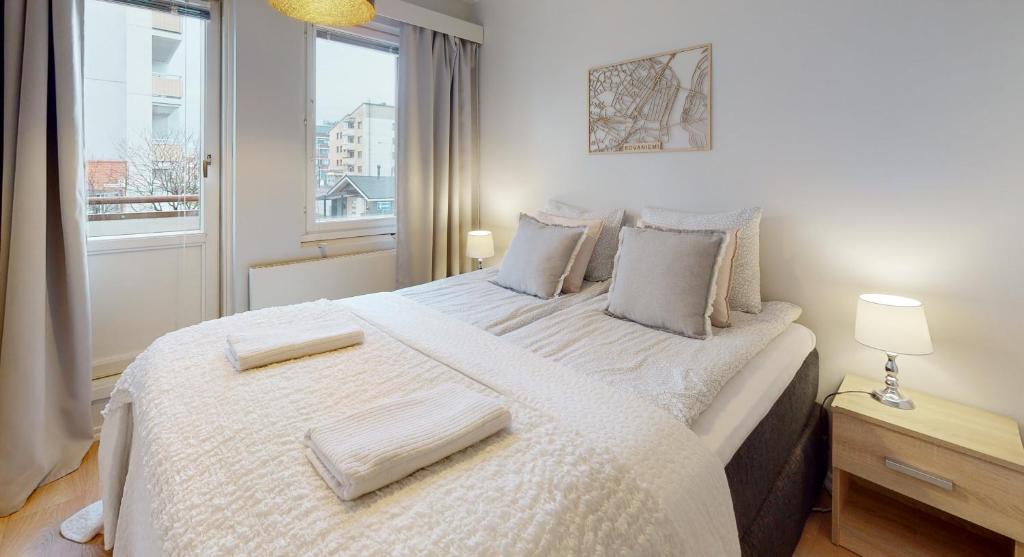 Llit o llits en una habitació de Bellarova Apartments I