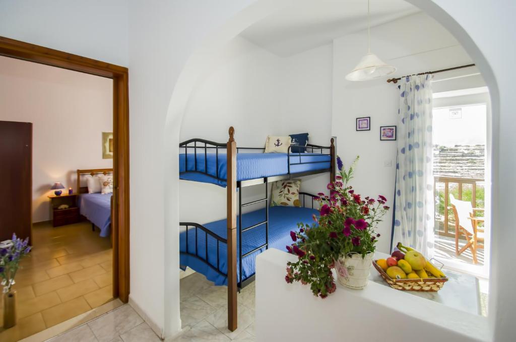 Ένα ή περισσότερα κρεβάτια σε δωμάτιο στο Palaios Rooms