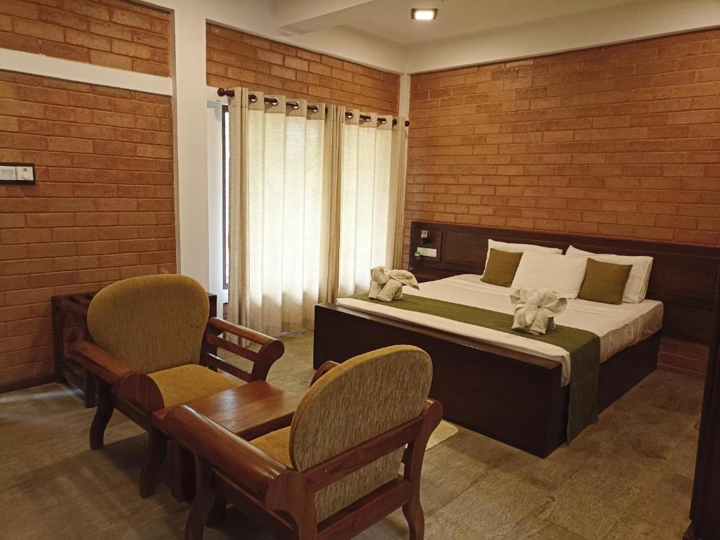 Postel nebo postele na pokoji v ubytování Kaveri Resort Sigiriya