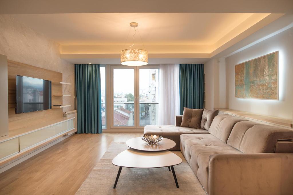 Una televisión o centro de entretenimiento en Apartment Gorazd