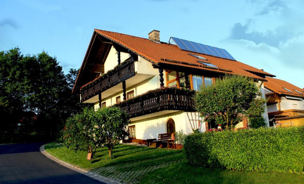 a house with a roof with solar panels on it at Haus Resi in Mähring
