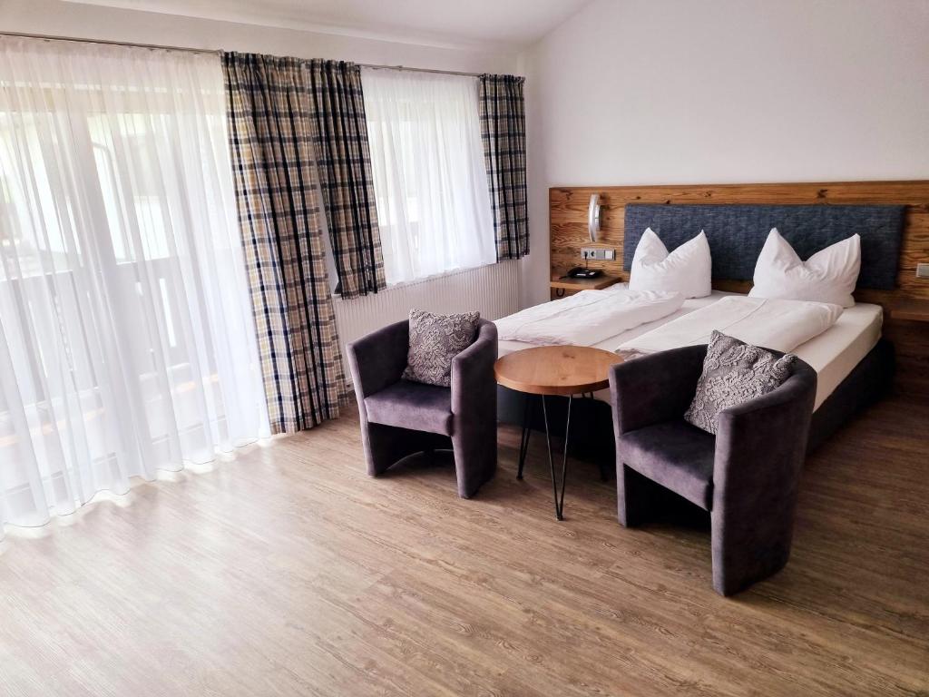 Postel nebo postele na pokoji v ubytování Hotel Beinbauer