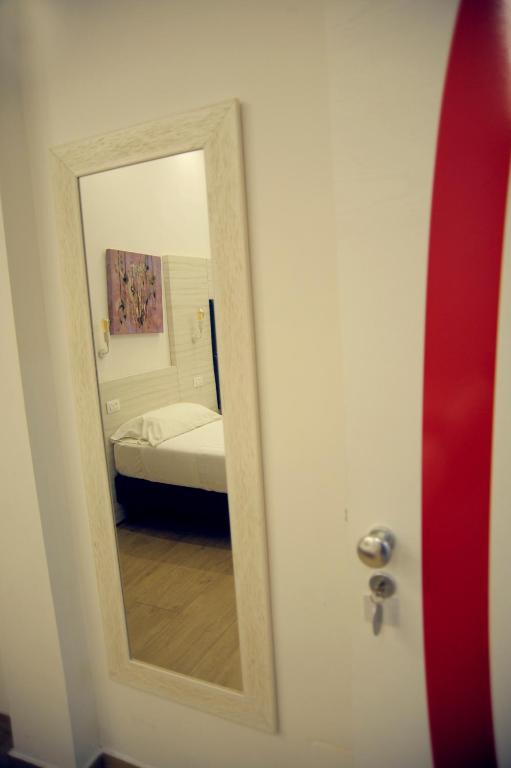 Łóżko lub łóżka w pokoju w obiekcie Hotel Fioralba