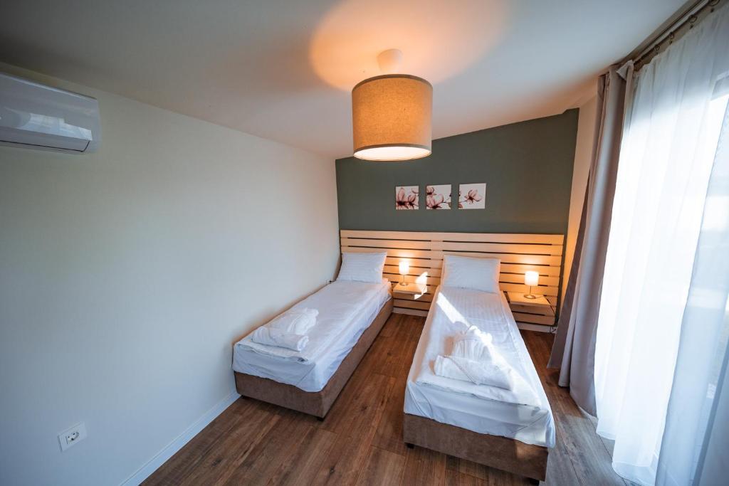 Postel nebo postele na pokoji v ubytování TERMAL KRE-SPA