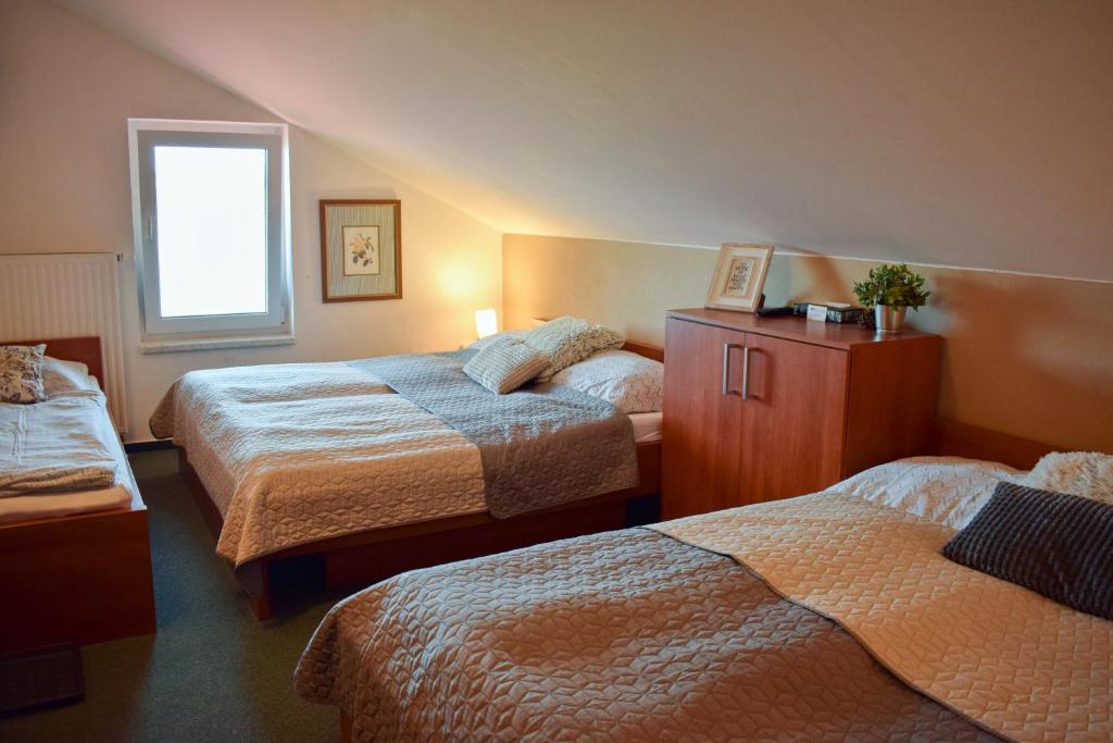 Postel nebo postele na pokoji v ubytování Penzion Rak Wellness