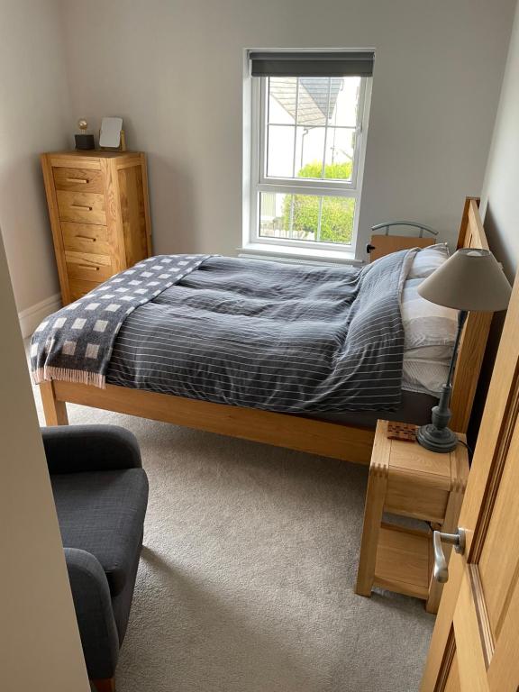 a bedroom with a bed and a window at Private Room in Saintfield in Saintfield