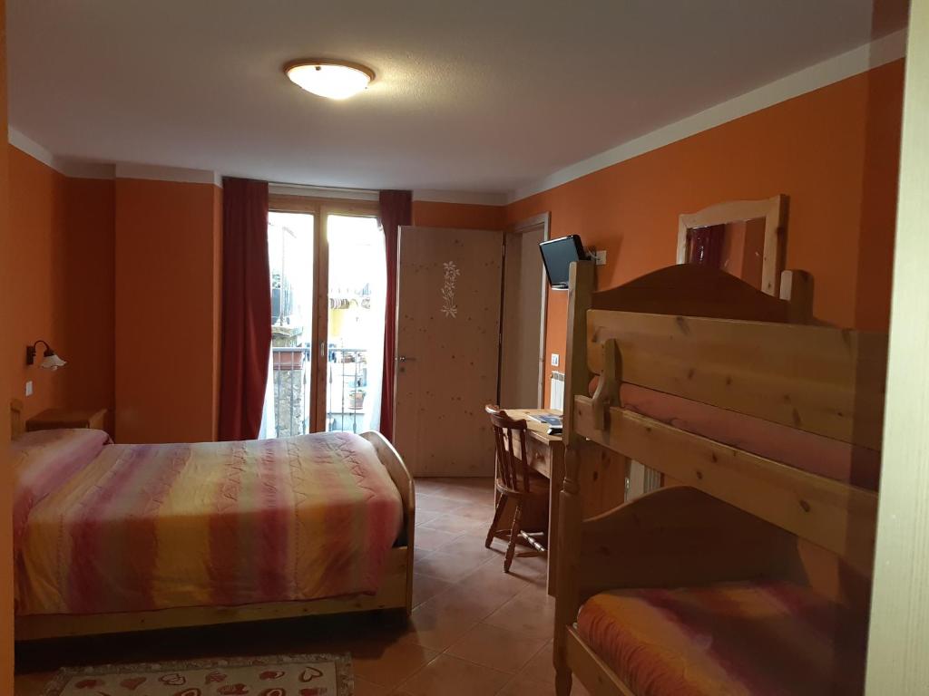 Postel nebo postele na pokoji v ubytování Agriturismo Belotti