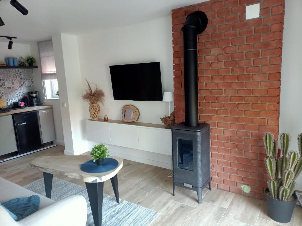 Televízia a/alebo spoločenská miestnosť v ubytovaní Magiczny Dom - Mountain Loft i Boho House