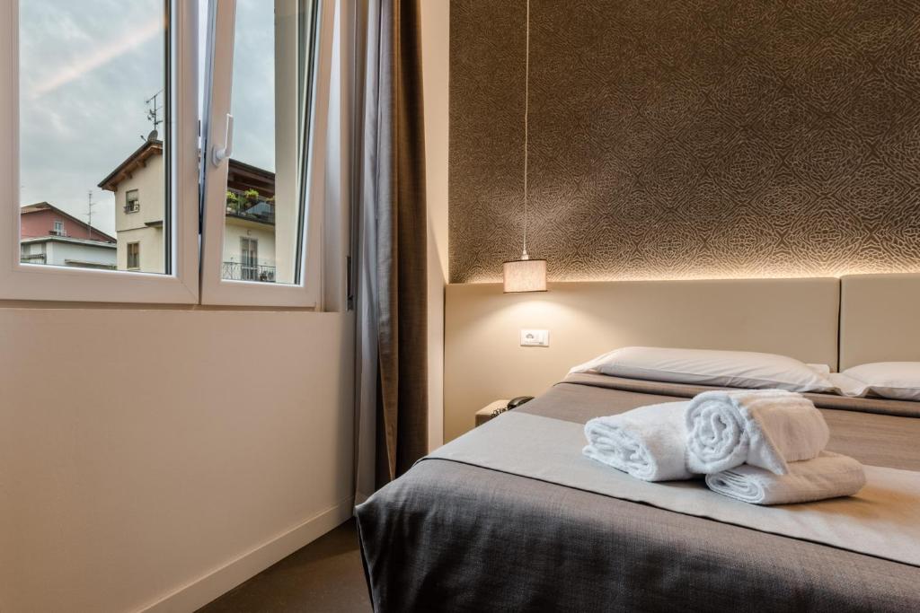 Posteľ alebo postele v izbe v ubytovaní Hotel Palazzo del Garda & Spa
