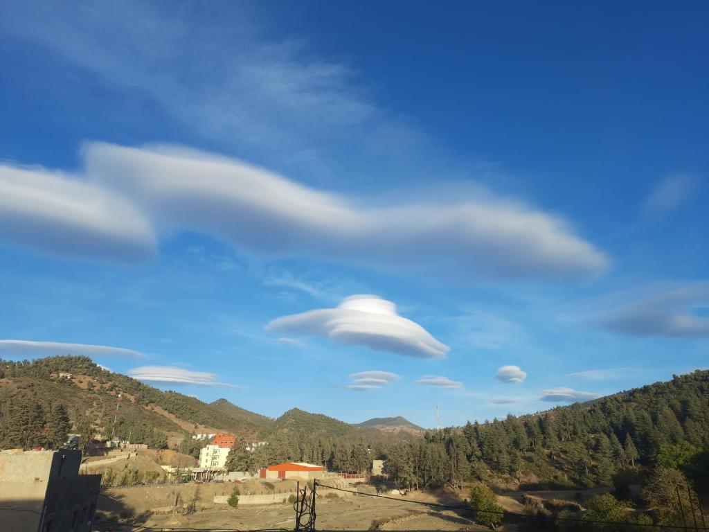 a cloud formation in the sky over a mountain at Farm tour in Tlata Ketama