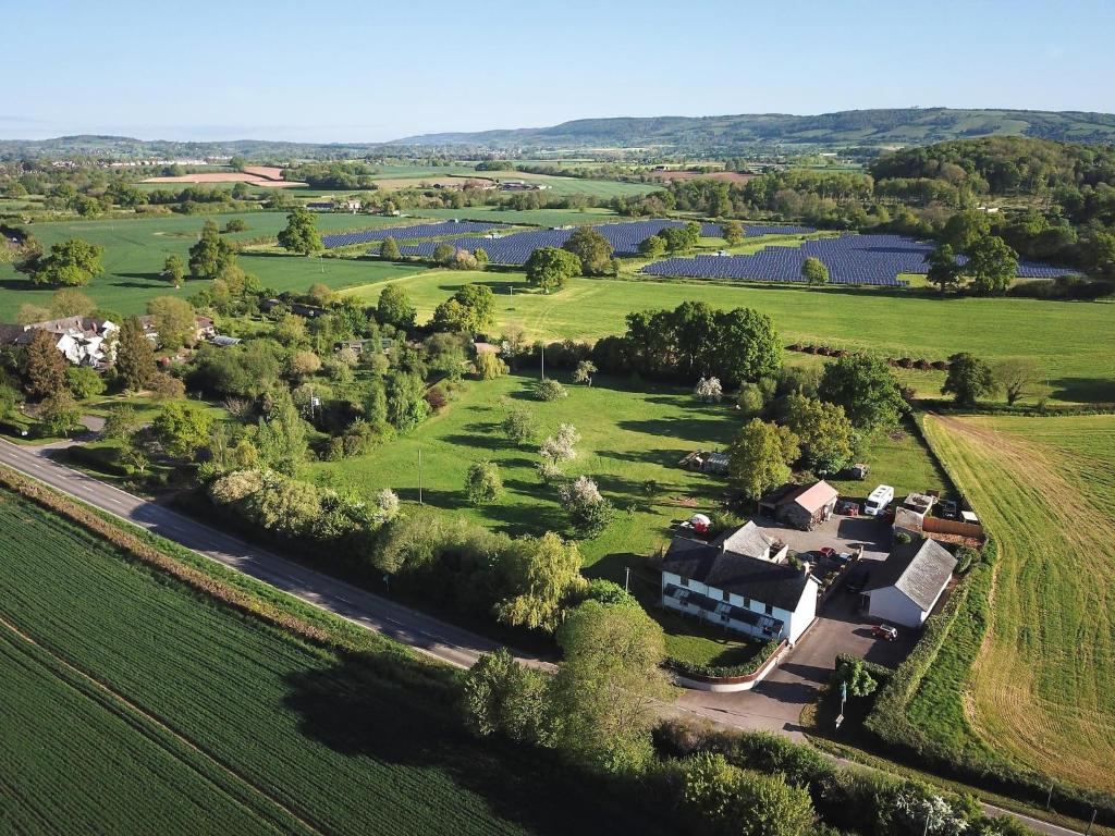 an aerial view of a house in a field at Wick House in Taunton